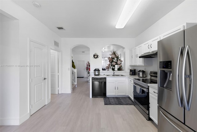 kitchen featuring white cabinets, appliances with stainless steel finishes, visible vents, and under cabinet range hood