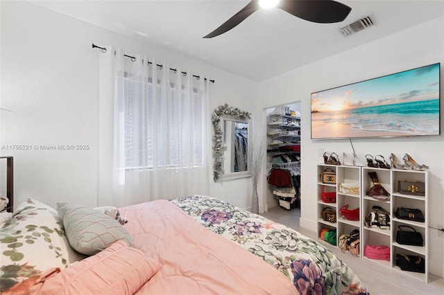 bedroom featuring a ceiling fan, a closet, and visible vents