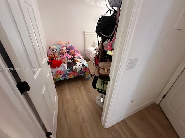 bedroom featuring wood finished floors