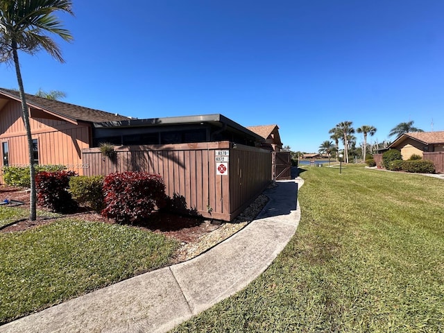 view of property exterior featuring a lawn