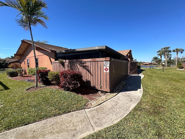 view of home's exterior featuring a yard