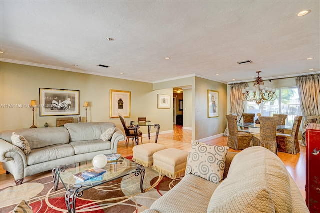 living area featuring visible vents, baseboards, an inviting chandelier, and light wood finished floors