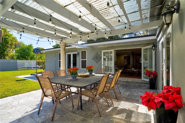 view of patio / terrace with outdoor dining area, french doors, fence, and a pergola