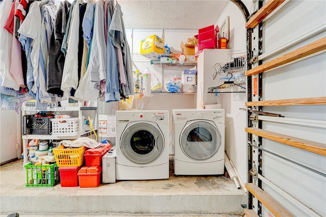 clothes washing area with laundry area and separate washer and dryer