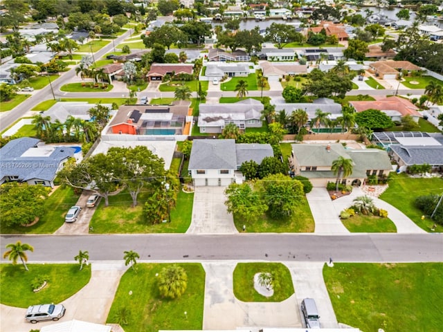 birds eye view of property with a residential view