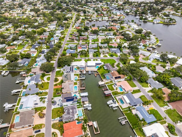 bird's eye view with a water view and a residential view