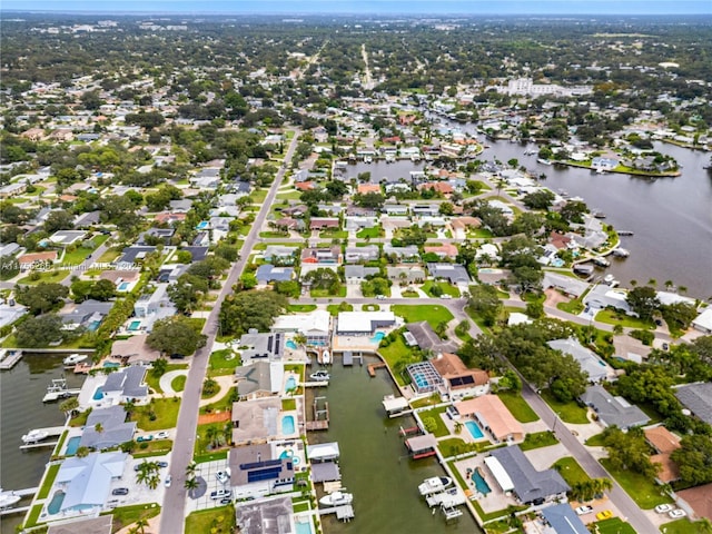 drone / aerial view featuring a water view and a residential view