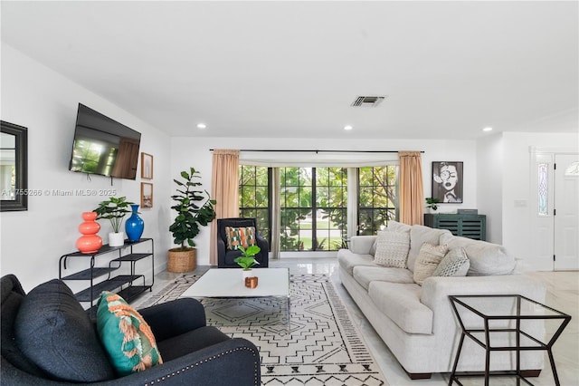 living room with visible vents and recessed lighting