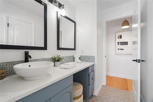 bathroom with vanity and baseboards