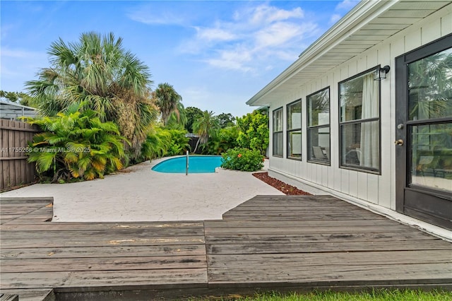 deck with a patio area and fence