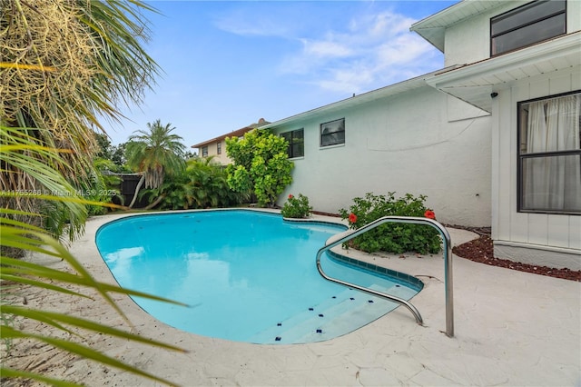 outdoor pool with a patio