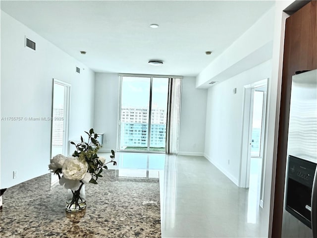 1945 S Ocean Dr Unit 2103, Hallandale Beach, FL 33009 - kitchen featuring stainless steel fridge with ice dispenser and stone countertops