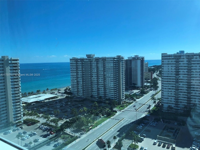 birds eye view of property featuring a water view and a city view