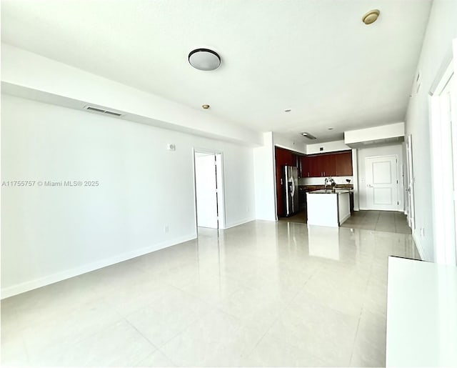 1945 S Ocean Dr Unit 2103, Hallandale Beach, FL 33009 - unfurnished living room with light tile patterned floors and baseboards
