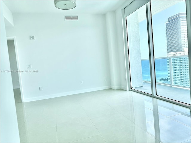 1945 S Ocean Dr Unit 2103, Hallandale Beach, FL 33009 - unfurnished room featuring light tile patterned flooring and baseboards