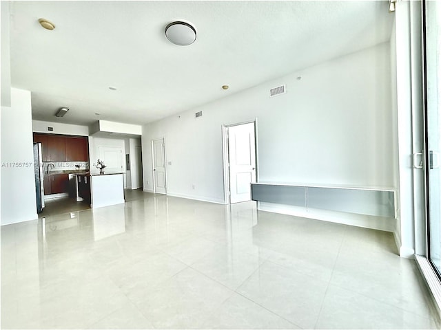 1945 S Ocean Dr Unit 2103, Hallandale Beach, FL 33009 - unfurnished living room featuring light tile patterned floors and baseboards