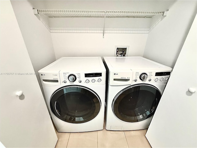 1945 S Ocean Dr Unit 2103, Hallandale Beach, FL 33009 - laundry room with independent washer and dryer and tile patterned flooring