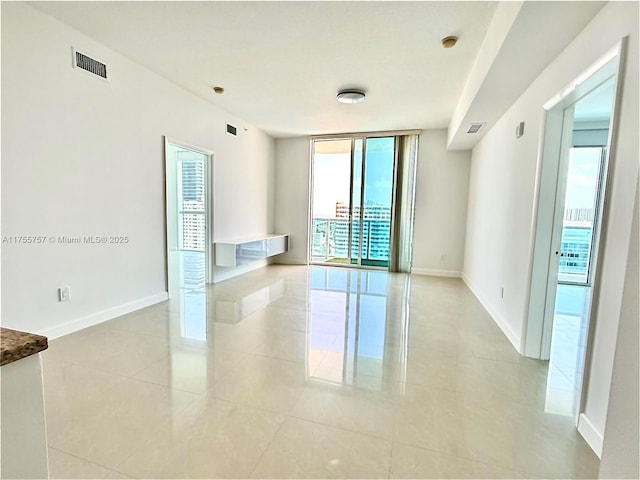 1945 S Ocean Dr Unit 2103, Hallandale Beach, FL 33009 - spare room with light tile patterned floors and expansive windows