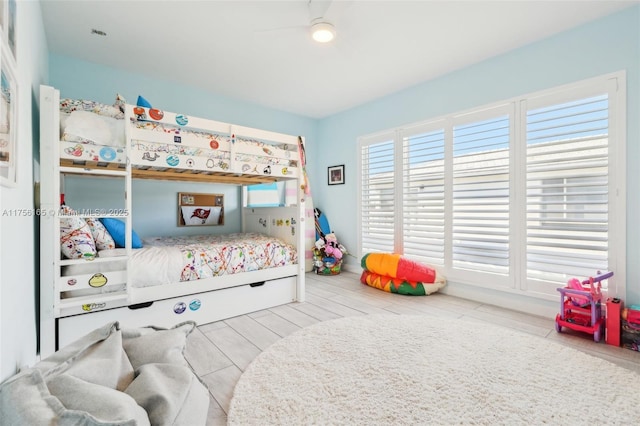 bedroom featuring wood finished floors and a ceiling fan