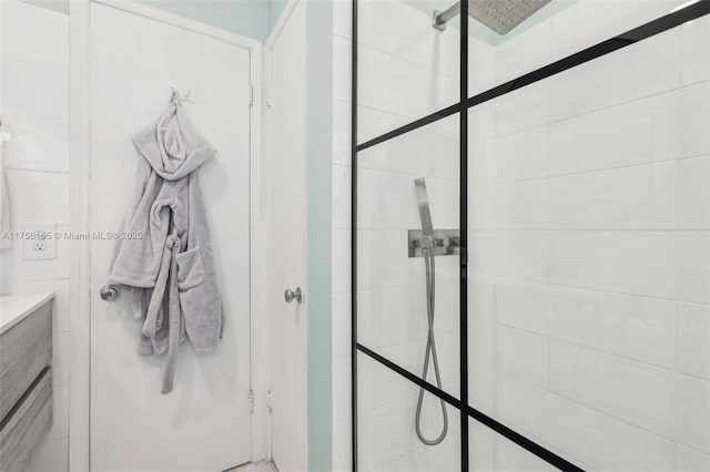 bathroom with a tile shower