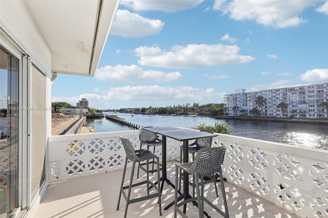 balcony featuring a water view