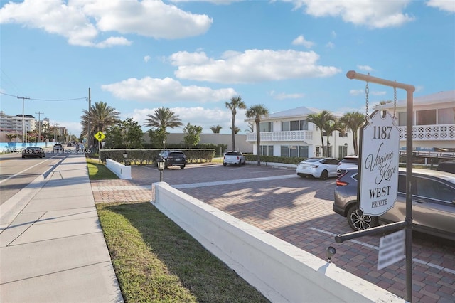 view of road with traffic signs and sidewalks