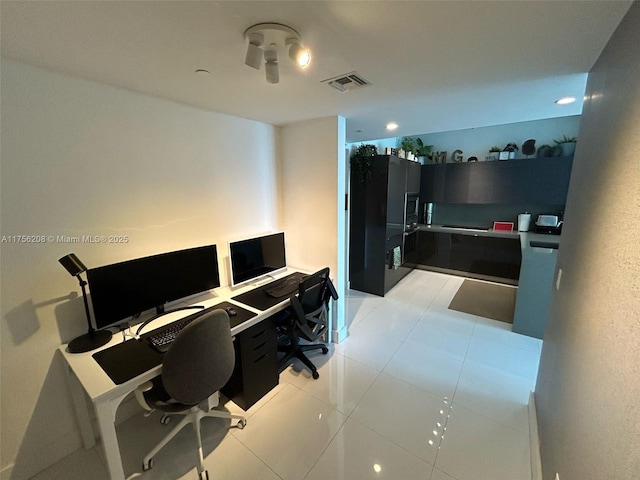 office featuring visible vents and light tile patterned floors