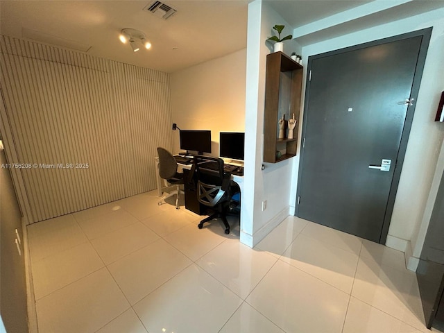 office with visible vents and tile patterned floors