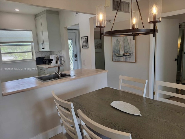 dining room featuring visible vents