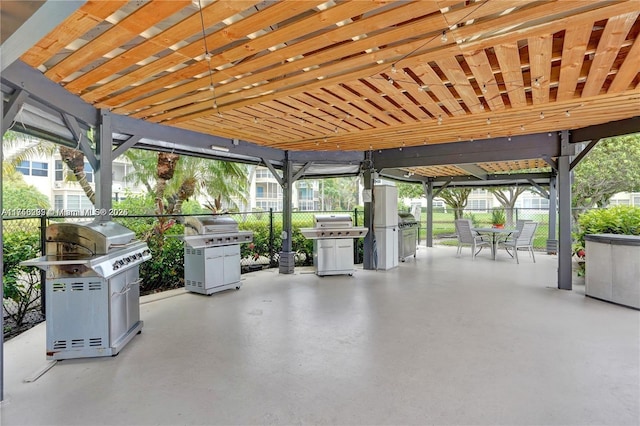 view of patio / terrace with outdoor dining space, area for grilling, and fence