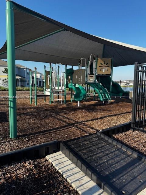 communal playground featuring fence