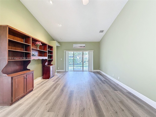 139 Sausalito Dr, Boynton Beach, FL 33436 - unfurnished living room featuring lofted ceiling, light wood-style floors, baseboards, and visible vents