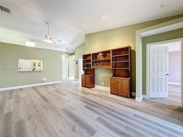 139 Sausalito Dr, Boynton Beach, FL 33436 - unfurnished living room with vaulted ceiling, light wood-type flooring, visible vents, and a ceiling fan