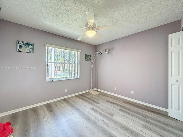 139 Sausalito Dr, Boynton Beach, FL 33436 - unfurnished room with ceiling fan, a textured ceiling, baseboards, and wood finished floors