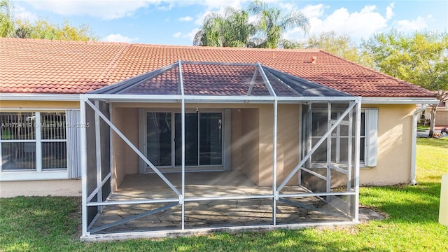 139 Sausalito Dr, Boynton Beach, FL 33436 - back of house featuring a tiled roof, a lanai, and stucco siding