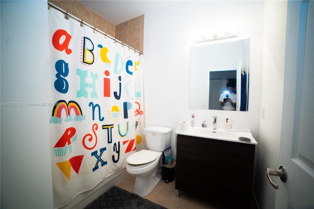 full bathroom featuring toilet, curtained shower, tile patterned flooring, and vanity