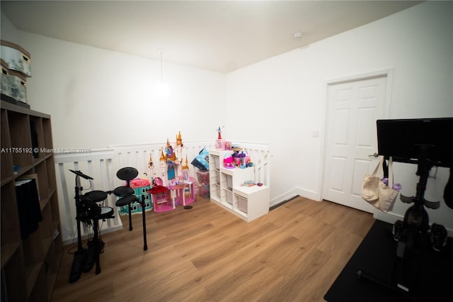 recreation room featuring wood finished floors