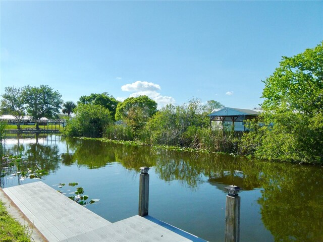1160 20th St, Bulkhead Ridge, FL 34974 - view of dock with a water view