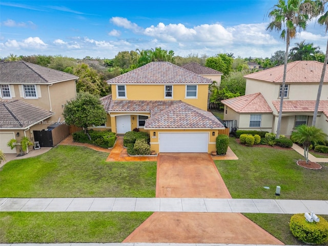 view of front of house featuring fence, driveway, a tiled roof, stucco siding, and a front lawn