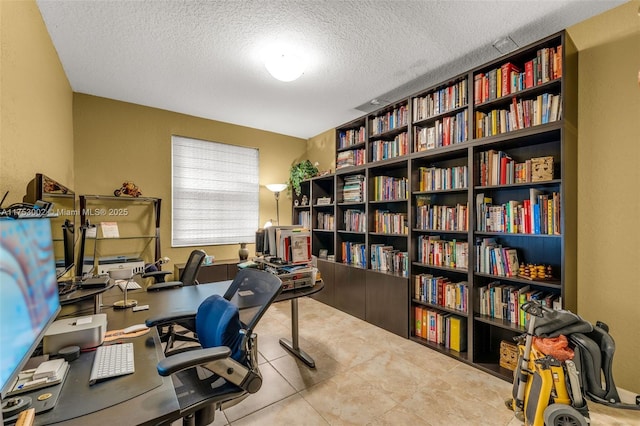 office with a textured ceiling and tile patterned floors