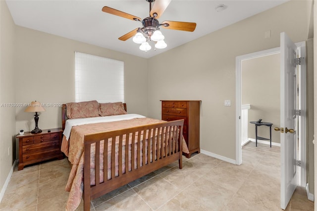 bedroom featuring a ceiling fan and baseboards