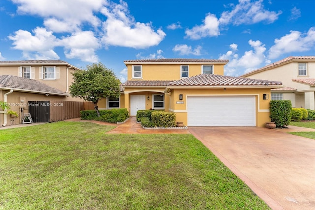 view of front of house with a garage, fence, driveway, stucco siding, and a front yard