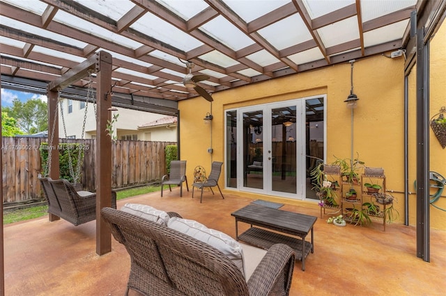 view of patio / terrace featuring fence, an outdoor living space, a pergola, and french doors