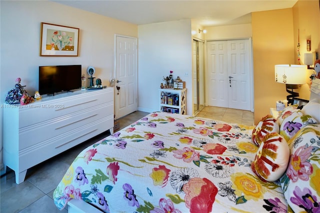 bedroom featuring a closet and tile patterned flooring