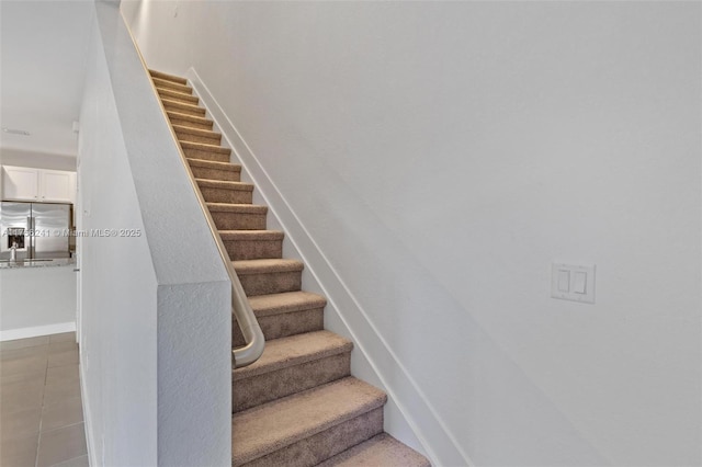 stairs featuring baseboards