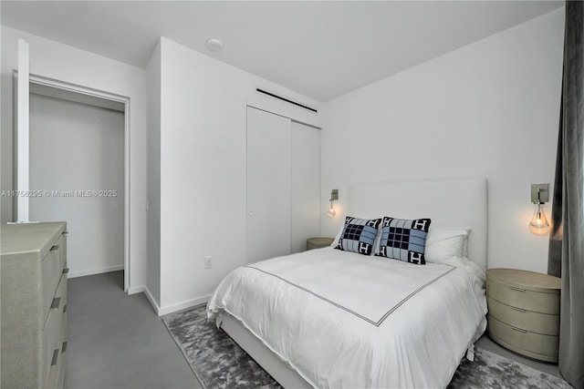 bedroom with a closet and baseboards