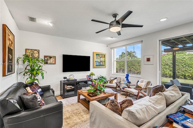 4471 Foxtail Ln, Weston, FL 33331 - living room with ceiling fan, a textured ceiling, light wood-type flooring, and visible vents