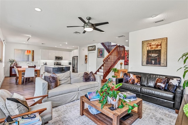 4471 Foxtail Ln, Weston, FL 33331 - living room with visible vents, recessed lighting, stairway, ceiling fan, and light wood-style flooring