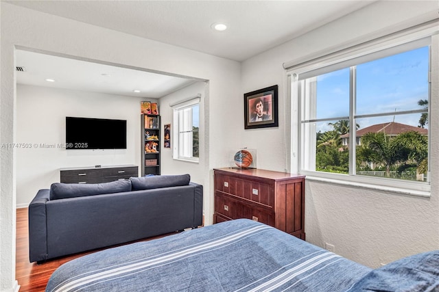 4471 Foxtail Ln, Weston, FL 33331 - bedroom with recessed lighting, a textured wall, and wood finished floors