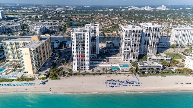 aerial view with a view of the beach, a view of city, and a water view